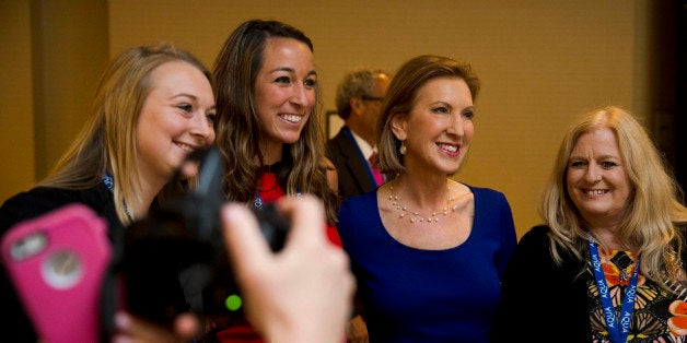 Republican presidential candidate Carly Fiorina poses for photographs, Friday, June 19, 2015, at the Northeast Republican Leadership Conference in Philadelphia. (AP Photo/Matt Rourke)