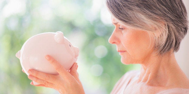 USA, New Jersey, Jersey City, Portrait of woman holding piggy bank