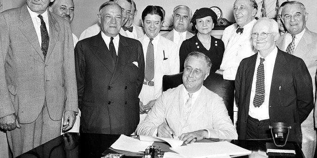 FLE - In this Aug. 14, 1935, file photo President Franklin Roosevelt signs the Social Security bill in Washington. Americans are getting older, but not this old: Social Security records show that 6.5 million people in the U.S. have reached the ripe old age of 112. In reality, only few could possibly be alive. As of last fall, there were only 42 people known to be that old in the entire world. But Social Security does not have death records for millions of people with birth dates stretching back as far as 1869, according to a report by the agencyâs inspector general. The first old-age monthly benefit check was paid in 1940, after President Franklin D. Roosevelt had signed the Social Security Act in 1935. (AP Photo, File)