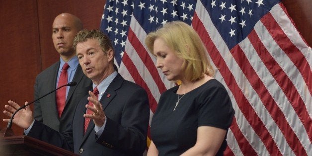 Senator Rand Paul , R-KY, speaks during a press conference with Senator Cory Booker, D-NJ, and Kirsten Gillibrand, D-NY, to announce a new medical marijuana bill at the US Capitol on March 10, 2014 in Washington, DC. The Compassionate Access, Research Expansion and Respect States (CARERS) Act would reclassify marijuana from a Schedule I to Schedule II drug and would amend federal law to allow states to set their own medical marijuana policies. AFP PHOTO/MANDEL NGAN (Photo credit should read MANDEL NGAN/AFP/Getty Images)