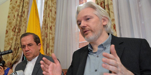 FILE - In this Aug. 18, 2014, file photo, Ecuador's Foreign Minister Ricardo Patino, left, and WikiLeaks founder Julian Assange speak during a news conference inside the Ecuadorian Embassy in London. Whistleblower site WikiLeaks has put hundreds of thousands of emails and documents from last year's Sony hack into a searchable online archive. Assange says that its database includes more than 170,000 emails from Sony Pictures Entertainment and a subsidiary, plus more than 30,000 other documents. (John Stillwell/Pool Photo via AP, File)