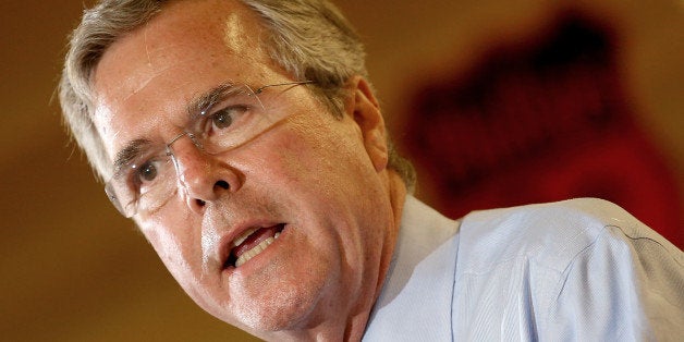 ANKENY, IA - AUGUST 13: Republican presidential candidate Jeb Bush speaks at Dennis Albaugh's Classic Car Barn during the Po