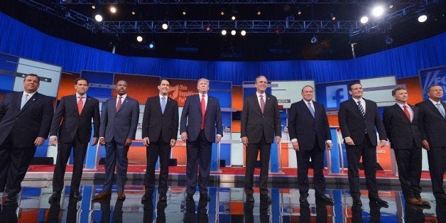 Republican presidential candidates arrive on stage for the Republican presidential debate on August 6, 2015 at the Quicken Loans Arena in Cleveland, Ohio. From left are: New Jersey Gov. Chris Christie; Florida Sen. Marco Rubio; retired neurosurgeon Ben Carson; Wisconsin Gov. Scott Walker; real estate magnate Donald Trump; former Florida Gov. Jeb Bush; former Arkansas Gov. Mike Huckabee; Texas Sen. Ted Cruz; Kentucky Sen. Rand Paul; and Ohio Gov. John Kasich. AFP PHOTO / MANDEL NGAN (Photo credit should read MANDEL NGAN/AFP/Getty Images)