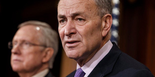 Sen. Chuck Schumer, D-N.Y., center, the Democratic Policy Committee chairman, and Senate Majority Leader Harry Reid, D-Nev., left, meet with reporters to urge passage of legislation to restore unemployment insurance benefits which expired Dec. 28, at the Capitol in Washington, Thursday, Jan. 9, 2014. (AP Photo/J. Scott Applewhite)