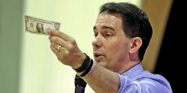 Republican presidential candidate, Wisconsin Gov. Scott Walker, speaks at the Alabama GOP summer luncheon as he tours the South, Saturday, Aug. 22, 2015, at the International Sports Hall of Fame in Talladega, Ala. (AP Photo/Butch Dill)