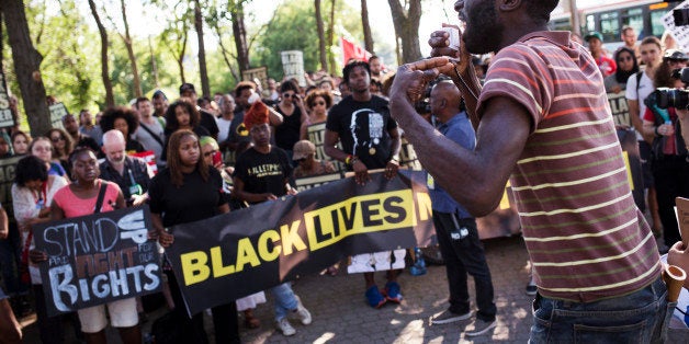 TORONTO, ON- JULY 27 - Desmond Cole addresses the crowd gathered for the Black Lives Matter protest, which started on Gilbert Avenue, where Andrew Loku was shot dead by police. (Melissa Renwick/Toronto Star via Getty Images)