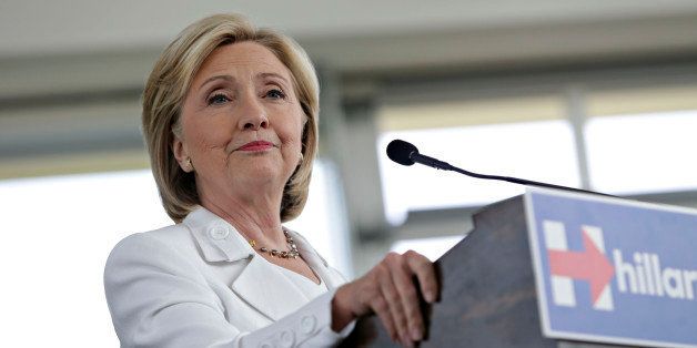 Hillary Clinton, former U.S. secretary of state and 2016 Democratic presidential candidate, pauses while speaking during a news conference in Ankeny, Iowa, U.S., on Wednesday, Aug. 26, 2015. Clinton is emphasizing investment in small towns to help strengthen rural America as part of a plan released after she was endorsed by U.S. Agriculture Secretary Tom Vilsack. Photographer: Daniel Acker/Bloomberg via Getty Images 