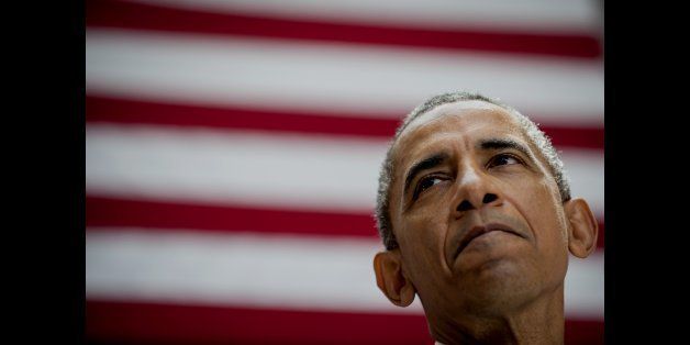 U.S. President Barack Obama pauses while speaking at American University's School of International Service in Washington, D.C., U.S., on Wednesday, Aug. 5, 2015. Obama's speech, held at the same venue in which President Kennedy delivered his famous 1963 speech on nuclear disarmament, focuses on the Iran Nuclear Deal being debated in Congress. Photographer: Pete Marovich/Bloomberg via Getty Images 