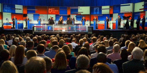 Republican presidential candidates from left, Chris Christie, Marco Rubio, Ben Carson, Scott Walker, Donald Trump, Jeb Bush, Mike Huckabee, Ted Cruz, Rand Paul, and John Kasich take the stage for the first Republican presidential debate at the Quicken Loans Arena Thursday, Aug. 6, 2015, in Cleveland. (AP Photo/John Minchillo)