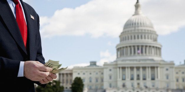 A politician counting money in front of the US Capitol Building