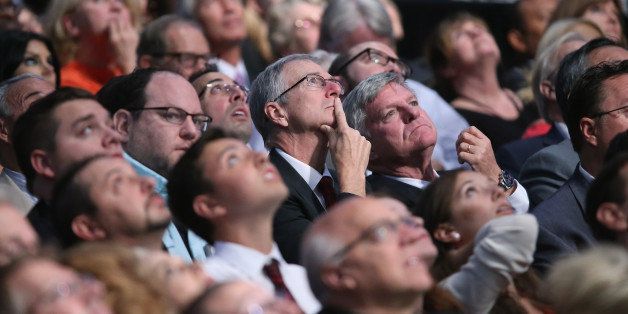 CLEVELAND, OH - AUGUST 06: Audience members look up at the large video screen hanging abouve the first prime-time Republican presidential debate hosted by FOX News and Facebook at the Quicken Loans Arena August 6, 2015 in Cleveland, Ohio. The top-ten GOP candidates were selected to participate in the debate based on their rank in an average of the five most recent national political polls. (Photo by Chip Somodevilla/Getty Images)
