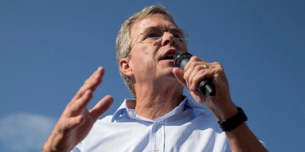 Jeb Bush, former governor of Florida and 2016 Republican presidential candidate, speaks to attendees at the Iowa State Fair Soapbox in Des Moines, Iowa, U.S., on Friday, Aug. 14, 2015. Sampling a fried Snickers bar and sidestepping a few hecklers, Bush made his way through the Iowa State Fair on Friday as he tried, and at times showed signs of struggling, to present himself as a fresh voice in the Republican presidential field. Photographer: Andrew Harrer/Bloomberg via Getty Images 