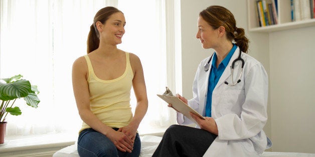 Patient talking to female doctor.