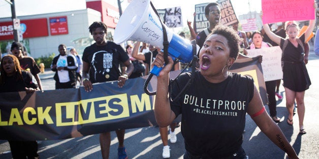 TORONTO, ON- JULY 27 - Pascale Diverlus yells into microphones during a Black Lives Matter protest that marched from Gilbert Avenue to Allen Road on Eglinton Avenue. The protest shut down the southbound Allen Road for around 30 minutes, causing traffic to reverse and exit through Lawrence Avenue. (Melissa Renwick/Toronto Star via Getty Images)