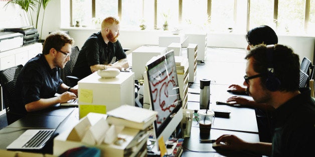 Businessmen and businesswoman working in startup office