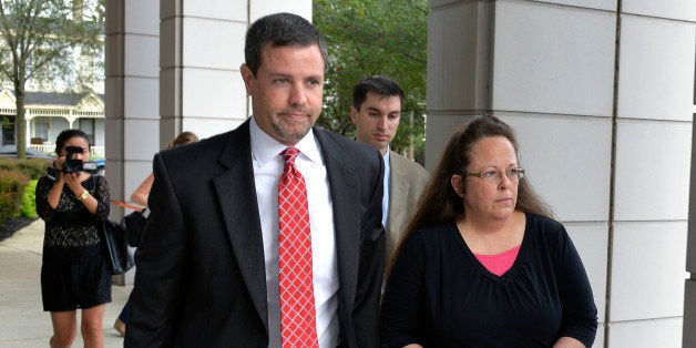 Rowan County Clerk Kim Davis, right, walks with her attorney Roger Gannam into the United States District Court for the Eastern District of Kentucky in Covington, Ky., Monday, July 20, 2015. Davis, who has said she cannot issue marriage licenses to same-sex couples because it would violate her religious beliefs, is being sued by the American Civil Liberties Union on the behalf of two gay couples and two straight couples. (AP Photo/Timothy D. Easley)