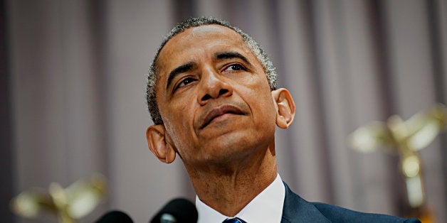 U.S. President Barack Obama pauses while speaking at American University's School of International Service in Washington, D.C., U.S., on Wednesday, Aug. 5, 2015. Obama's speech, held at the same venue in which President Kennedy delivered his famous 1963 speech on nuclear disarmament, focuses on the Iran Nuclear Deal being debated in Congress. Photographer: Pete Marovich/Bloomberg via Getty Images 