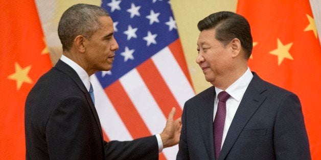 U.S. President Barack Obama, left, and Chinese President Xi Jinping shake hands following the conclusion of their joint news conference at the Great Hall of the People in Beijing, Wednesday, Nov. 12, 2014. (AP Photo/Pablo Martinez Monsivais)