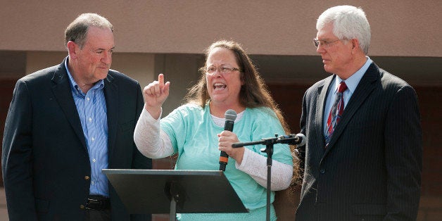 GRAYSON, KY - SEPTEMBER 8: Rowan County Clerk of Courts Kim Davis speaks next to her attorney Mat Staver (R) and Republican presidential candidate Mike Huckabee (L) in front of the Carter County Detention Center on September 8, 2015 in Grayson, Kentucky. Davis was ordered to jail last week for contempt of court after refusing a court order to issue marriage licenses to same-sex couples. (Photo by Ty Wright/Getty Images)