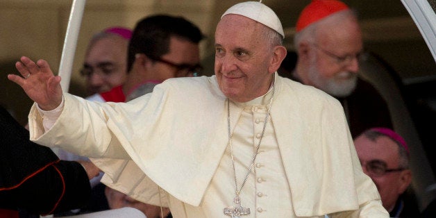 Pope Francis leaves after a meeting with a group of Cuban youth in Havana, Cuba, Sunday Sept. 20, 2015. Pope Francis met with Fidel Castro on Sunday before finishing the day with a vespers service in Havana's cathedral, and a meeting with the youths. In the background at right is Cardinal Sean Patrick O'Malley. (AP Photo/Ramon Espinosa)