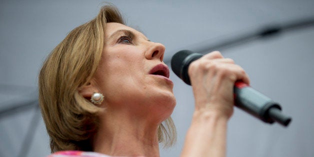 Carly Fiorina, former chairman and chief executive officer of Hewlett-Packard Co. and 2016 Republican presidential candidate, speaks to attendees at the Iowa State Fair Soapbox in Des Moines, Iowa, U.S., on Monday, Aug. 17, 2015. Fiorina said yesterday she is 'not clear' if Donald Trump is a Republican and isn't convinced of his loyalty to the GOP. Photographer: Andrew Harrer/Bloomberg via Getty Images 