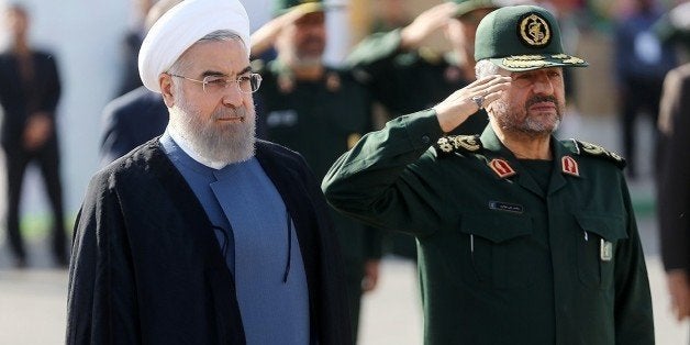 TEHRAN, IRAN - SEPTEMBER 15: Iranian President Hassan Rouhani (L) and IRGC Major General Mohammad Ali Jafari (R) attend the
