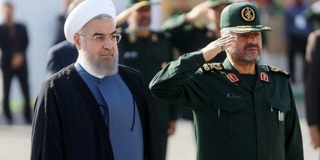 TEHRAN, IRAN - SEPTEMBER 15: Iranian President Hassan Rouhani (L) and IRGC Major General Mohammad Ali Jafari (R) attend the 21st Nationwide Assembly of the Islamic Revolution Guards Corps (IRGC) Commanders in Tehran, Iran on September 15, 2015. (Photo by Pool/Iranian Presidency Press Office/Anadolu Agency/Getty Images)