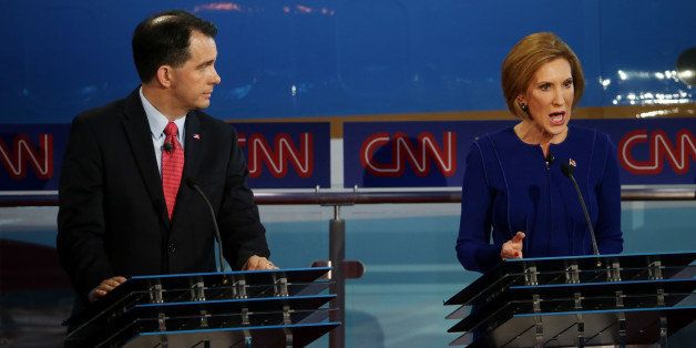 SIMI VALLEY, CA - SEPTEMBER 16: Republican presidential candidates Carly Fiorina and Wisconsin Gov. Scott Walker take part in the presidential debates at the Reagan Library on September 16, 2015 in Simi Valley, California. Fifteen Republican presidential candidates are participating in the second set of Republican presidential debates. (Photo by Justin Sullivan/Getty Images)
