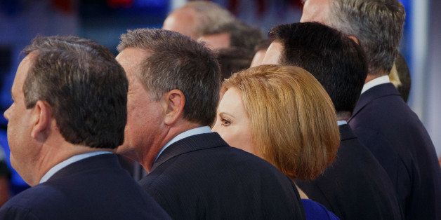 Carly Fiorina, former chairman and chief executive officer of Hewlett-Packard Co. and 2016 Republican presidential candidate, center, stands on stage alongside Chris Christie, John Kasich, Scott Walker, and Jeb Bush during the Republican presidential debate at the Ronald Reagan Presidential Library in Simi Valley, California, U.S., on Wednesday, Sept. 16, 2015. The main debate of the top 11 GOP contenders in the polls follows the 'kids' table' debate of candidates who didn't make the cut. Photographer: Patrick T. Fallon/Bloomberg via Getty Images 
