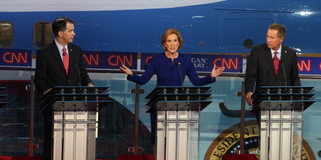 SIMI VALLEY, CA - SEPTEMBER 16: Republican presidential candidates, Wisconsin Gov. Scott Walker, Carly Fiorina and Ohio Gov. John Kasich takes part in the presidential debates at the Reagan Library on September 16, 2015 in Simi Valley, California. Fifteen Republican presidential candidates are participating in the second set of Republican presidential debates. (Photo by Justin Sullivan/Getty Images)