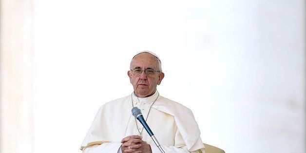Pope Francis prays during his weekly general audience in St Peter's square at the Vatican on September 9, 2015. In a letter to believers on September 8, the Argentinian pontiff said annulments would require approval by only one church tribunal, rather than two as currently. A streamlined procedure is to be introduced for the most straightforward cases and access to hearings will not cost anything, the letter states. AFP PHOTO / FILIPPO MONTEFORTE (Photo credit should read FILIPPO MONTEFORTE/AFP/Getty Images)