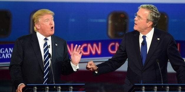 Republican presidential hopefuls Donald Trump and Jeb Bush speak during the Presidential debate at the Ronald Reagan Presidential Library in Simi Valley, California on September 16, 2015. Republican presidential frontrunner Donald Trump stepped into a campaign hornet's nest as his rivals collectively turned their sights on the billionaire in the party's second debate of the 2015. AFP PHOTO / FREDERIC J. BROWN (Photo credit should read FREDERIC J. BROWN/AFP/Getty Images)