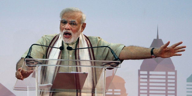Indian Prime Minister Narendra Modi addresses Indian expatriates at a cricket stadium, Monday, Aug. 17, 2015, in Dubai, Unite