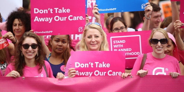 MANHATTAN, NEW YORK CITY, NEW YORK, UNITED STATES - 2015/09/29: Participants hold pink Planned Parenthood banner and signs. Activists and directors of Planned Parenthood, NYC, gathered in Foley Square along NYC first lady Chirlane McCray and elected representatives to demonstrate support for the organization. (Photo by Andy Katz/Pacific Press/LightRocket via Getty Images)