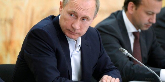 Russian President Vladimir Putin attends a meeting on agriculture while visiting farms in Rostov region, Russia, Thursday, S