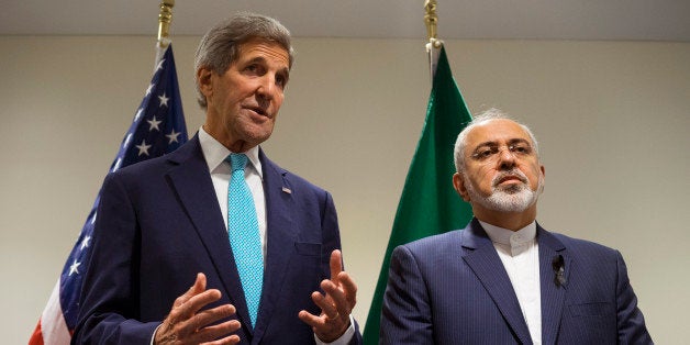 US Secretary of State John Kerry, left, speaks during a meeting with Iranian Foreign Minister Mohammad Javad Zarif at United Nations headquarters Saturday, Sept. 26, 2015. (AP Photo/Craig Ruttle)