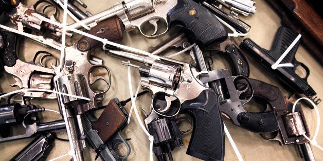 DETROIT, MI - MAY 18: Guns people brought in to exchange for a $50 Meijer gift card at a 'Groceries For Guns' gun buyback program are shown May 18, 2013 at the New St. Paul Tabernacle Church of God in Christ in Detroit, Michigan. The event was sponsored by the law firm Goodman Acker P.C. in a public-private partnership with Wayne County. (Photo by Bill Pugliano/Getty Images)