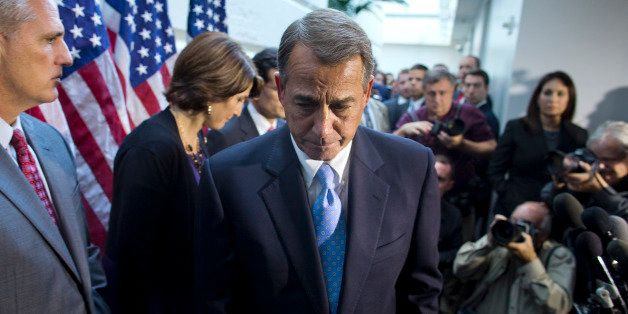 House Speaker John Boehner, R-Ohio, walks away from the microphone during a news conference after a House GOP meeting on Capitol Hill, Tuesday, Oct. 15, 2013, in Washington. House GOP leaders Tuesday floated a plan to fellow Republicans to counter an emerging Senate deal to reopen the government and forestall an economy-rattling default on U.S. obligations. But the plan got mixed reviews from the rank and file, and it was not clear whether it could pass the chamber. (AP Photo/ Evan Vucci)
