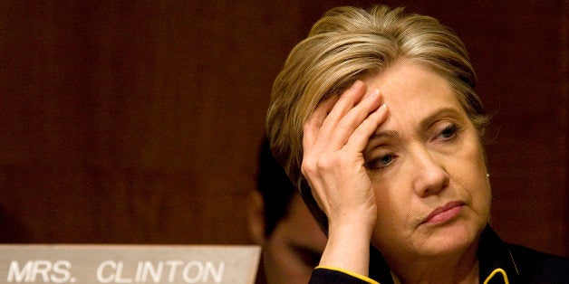 Sen. Hillary Clinton (D-NY) listens as Army General David Petraeus, top commander of U.S. forces in Iraq, and U.S. Ambassador to Iraq Ryan Crocker, deliver their testimony to the U.S. Senate Armed Services Committee on the state of the war in Iraq, Tuesday, April 8, 2008, on Capitol Hill in Washington, D.C. (Photo by Chuck Kennedy/MCT/MCT via Getty Images)