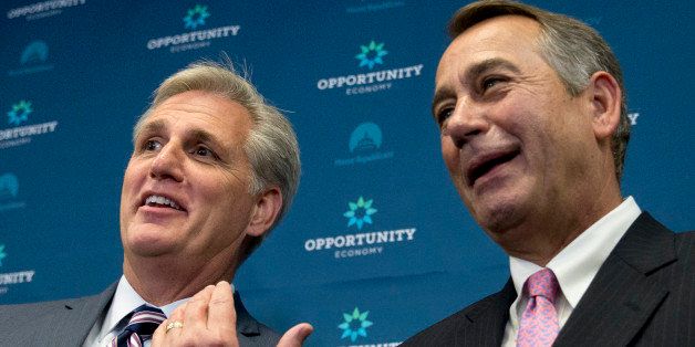 House Majority Leader Kevin McCarthy of Calif. gestures toward outgoing House Speaker John Boehner of Ohio during a new conference on Capitol Hill in Washington, Tuesday, Sept. 29, 2015. McCarthy is assuring Republicans he can bring them together, even as emboldened conservatives maneuver to yank their party to the right in the wake of the leader of the U.S. House of Representatives Speaker John Boehner's sudden resignation. (AP Photo/Carolyn Kaster)