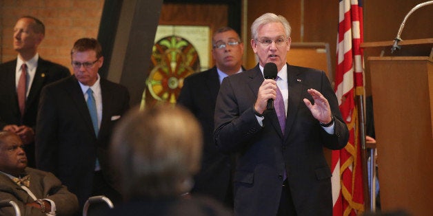 FERGUSON, MO - AUGUST 14: Missouri Governor Jay Nixon speaks about the unrest in the town of Ferguson following the shooting death of Michael Brown to residents and faith and community leaders during a forum held at Christ the King UCC Church on August 14, 2014 in Florissant, Missouri. Brown was shot an killed by a Ferguson police officer on August 9. Ferguson, a St. Louis suburb, has experienced four days of violent protests since the killing. (Photo by Scott Olson/Getty Images)