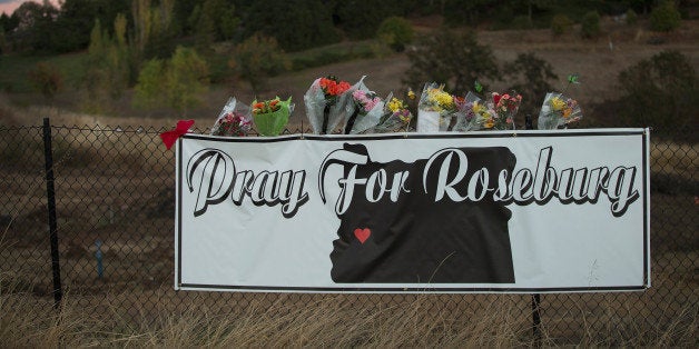 ROSEBURG, OR - OCTOBER 02: A sign sits along the road to Umpqua Community College on October 2, 2015 in Roseburg, Oregon. Y