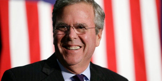 Republican presidential candidate former Florida Gov. Jeb Bush reacts on stage during the Scott County Republican Party's Ronald Reagan Dinner, Tuesday, Oct. 6, 2015, in Davenport, Iowa. (AP Photo/Charlie Neibergall)