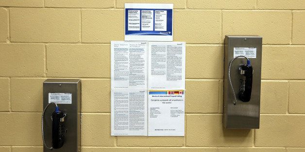 FREMONT, CA - AUGUST 01: Pay phones for inmates are seen on a wall at the Fremont Police Detention Facility on August 1, 2013 in Fremont, California. The Fremont Police Department has started to offer inmates who are serving short sentences on lesser charges an option to ''pay to stay'' for a one-time fee of $45 and $155 a night to stay in a smaller, quieter facility and avoid going to county jails. The city could stand to make $244,000 annually if 16 inmates spent two nights a week under the program. (Photo by Justin Sullivan/Getty Images)