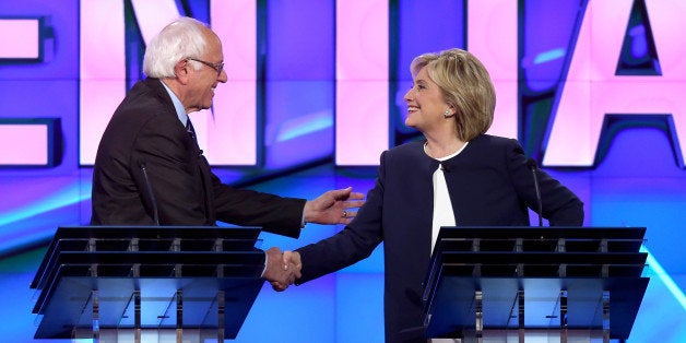 LAS VEGAS, NV - OCTOBER 13: Democratic presidential candidates U.S. Sen. Bernie Sanders (I-VT) (L) and Hillary Clinton shake hands at the end of a presidential debate sponsored by CNN and Facebook at Wynn Las Vegas on October 13, 2015 in Las Vegas, Nevada. Five Democratic presidential candidates are participating in the party's first presidential debate. (Photo by Joe Raedle/Getty Images)