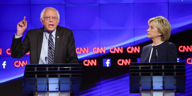 Senator Bernie Sanders, an independent from Vermont, left, and Hillary Clinton, former U.S. secretary of state, participate in the first Democratic presidential debate at the Wynn Las Vegas resort and casino in Las Vegas, Nevada, U.S., on Tuesday, Oct. 13, 2015. While tonight's first Democratic presidential debate will probably lack the name-calling and sharp jabs of the Republican face-offs, there's still potential for strong disagreements between the party's leading contenders. Photographer: Josh Haner/Pool via Bloomberg 