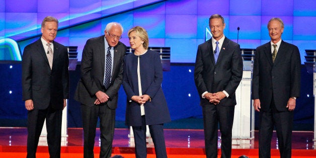 Democratic presidential candidates from left, former Virginia Sen. Jim Webb, Sen. Bernie Sanders, I-Vt., Hillary Rodham Clinton, former Maryland Gov. Martin O'Malley, and former Rhode Island Gov. Lincoln Chafee take the stage before the CNN Democratic presidential debate Tuesday, Oct. 13, 2015, in Las Vegas. (AP Photo/John Locher)