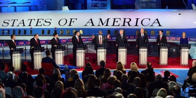 Republican presidential hopefuls (L-R), Kentucky Sen. Rand Paul, former Arkansas Gov. Mike Huckabee , Florida Sen. Marco Rubio, Texas Sen. Ted Cruz, real estate magnate Donald Trump, former Florida Gov. Jeb Bush, Wisconsin Gov. Scott Walker, and former CEO Carly Fiorina, listen as retired neurosurgeon Ben Carson (C) speaks during the Presidential debate at the Ronald Reagan Presidential Library in Simi Valley, California on September 16, 2015. Republican presidential frontrunner Donald Trump stepped into a campaign hornet's nest as his rivals collectively turned their sights on the billionaire in the party's second debate of the 2015. AFP PHOTO / FREDERIC J. BROWN (Photo credit should read FREDERIC J. BROWN/AFP/Getty Images)