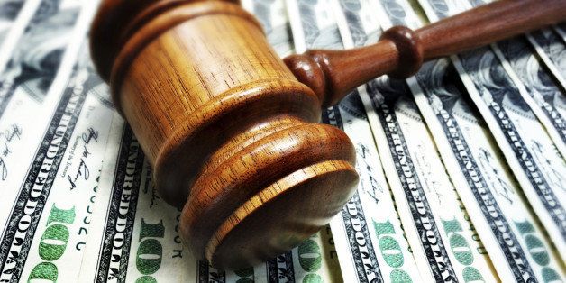A court gavel on 100 bills - legal concept