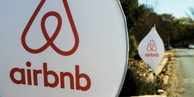 The logos of Airbnb Inc. sit on banners displayed outside a media event in Johannesburg, South Africa, on Monday, July 27, 20